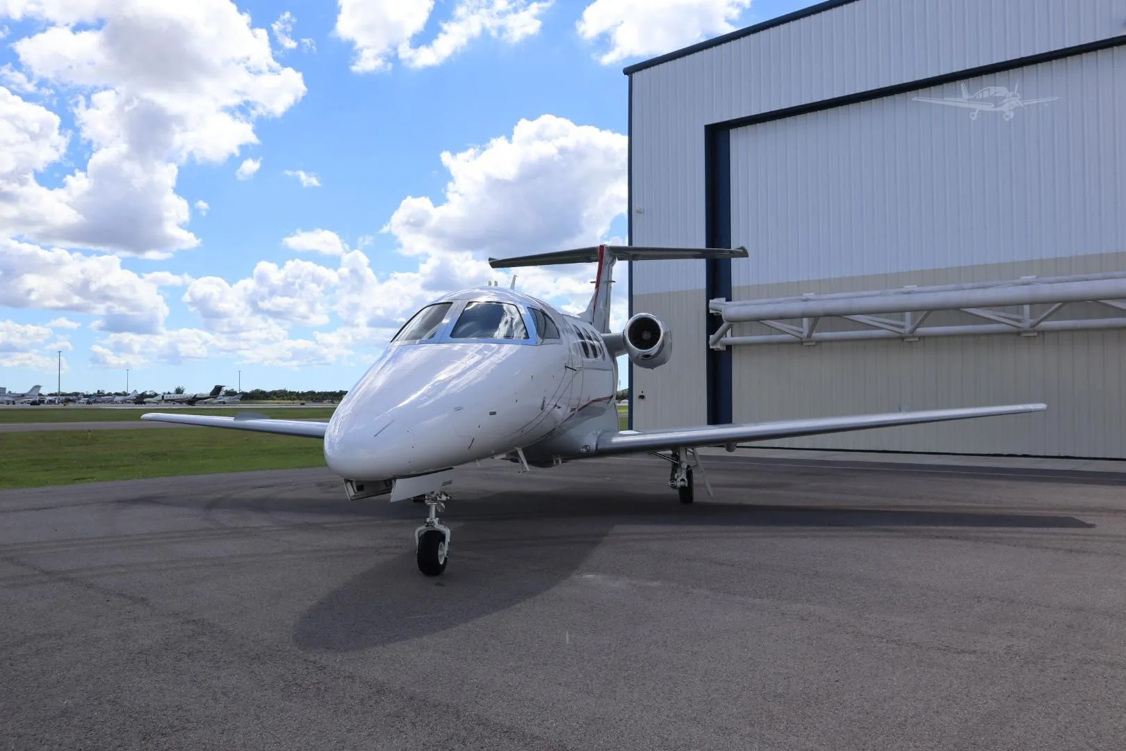 Exterior view of a 2009 EMBRAER PHENOM 100, N701TW.
