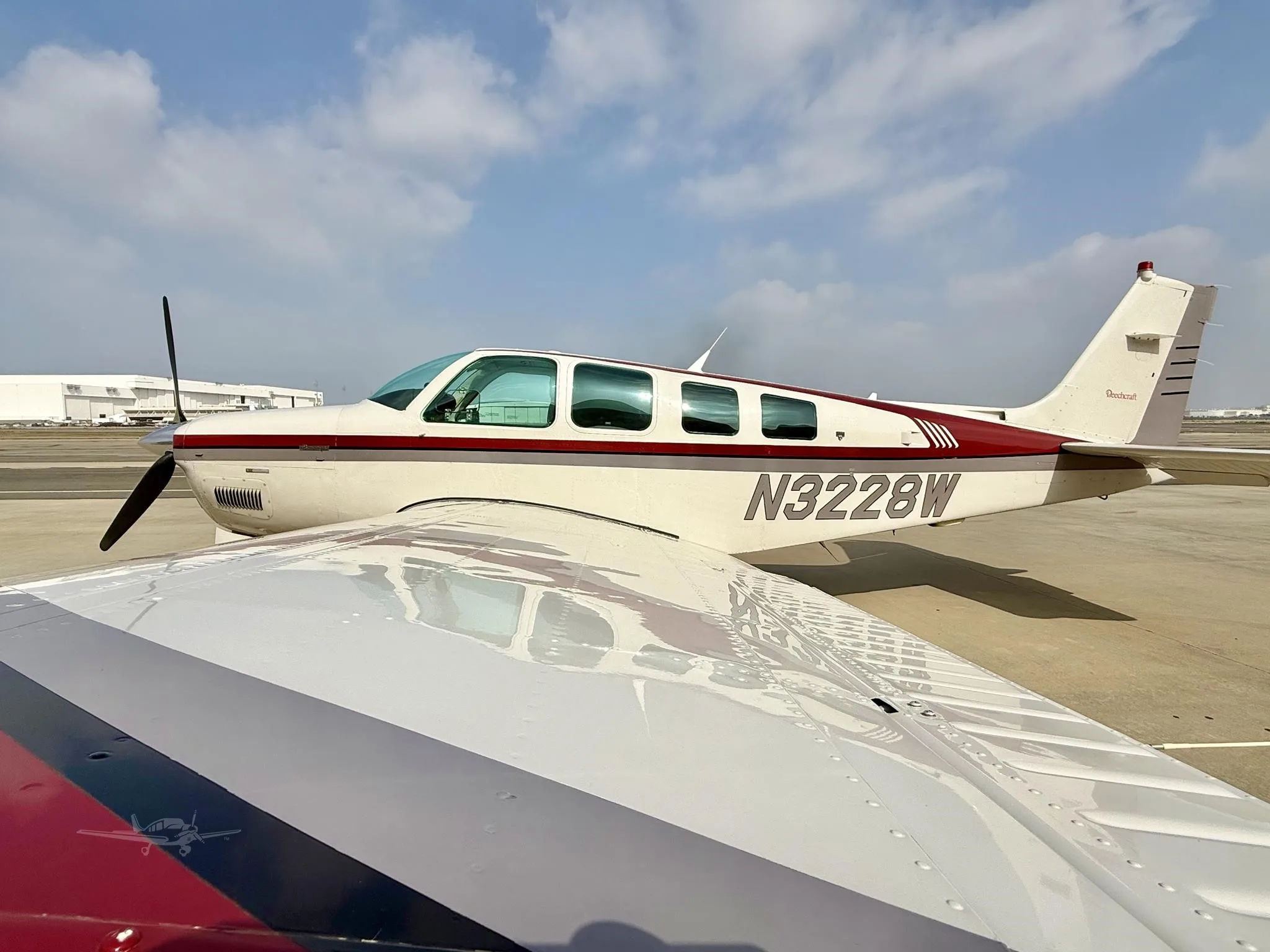 Exterior view of a 1995 BEECHCRAFT A36 BONANZA, N3228W.