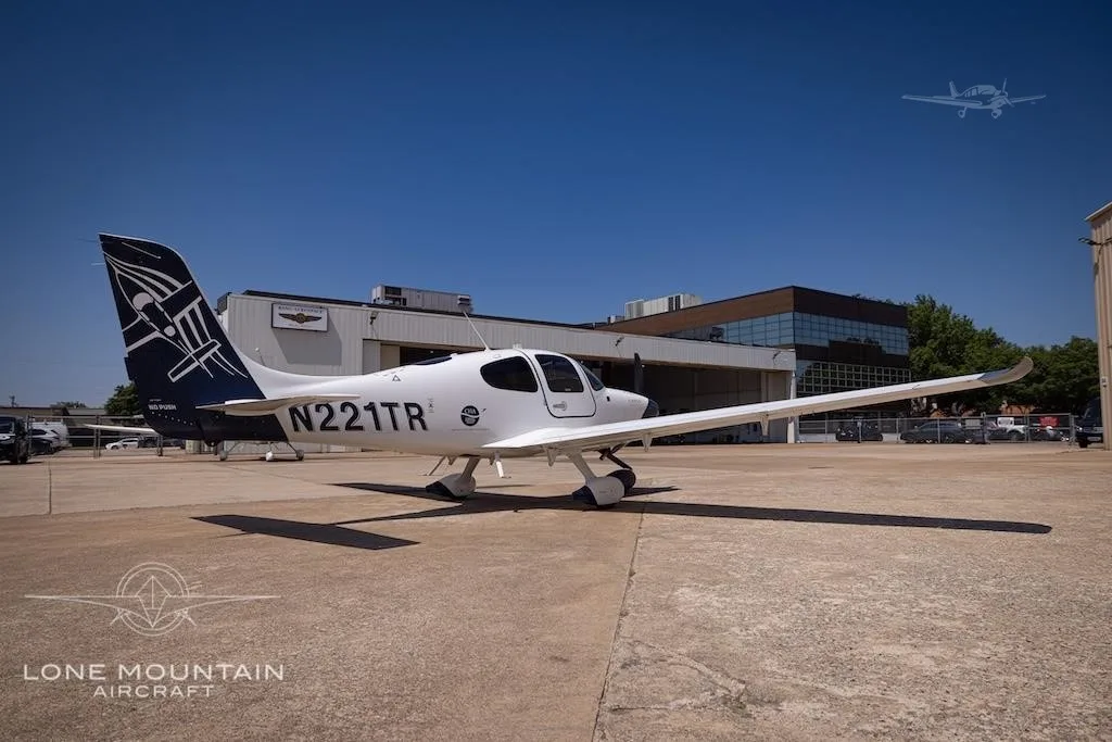 Exterior view of a 2021 CIRRUS SR20-G6, N221TR.