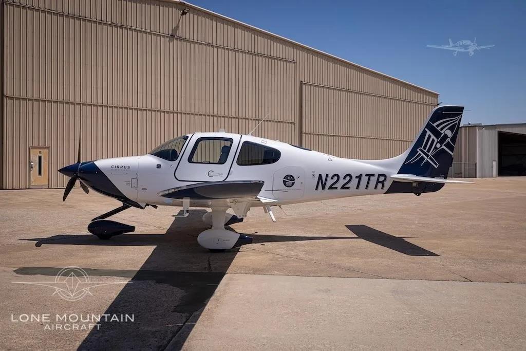 Exterior view of a 2021 CIRRUS SR20-G6, N221TR.