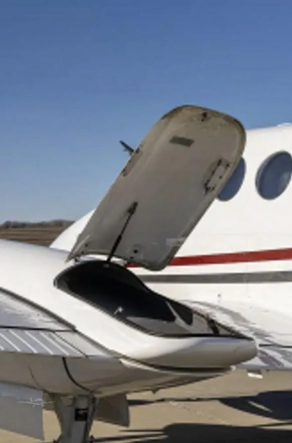Exterior view of a 1977 BEECHCRAFT KING AIR 200, N703M.