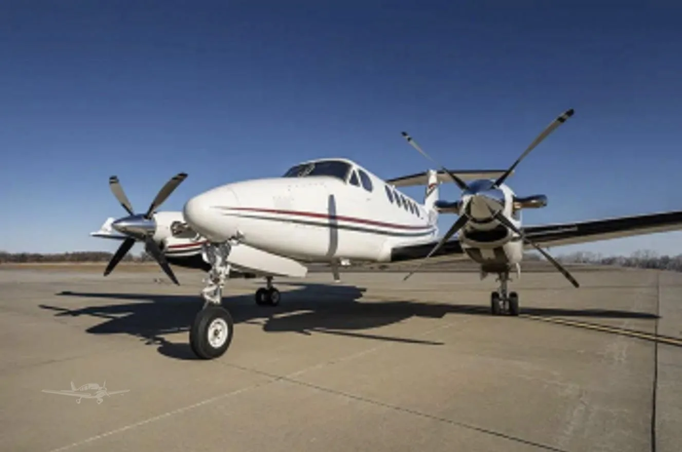 Exterior view of a 1977 BEECHCRAFT KING AIR 200, N703M.
