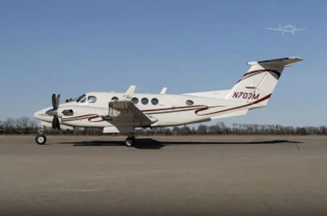 Exterior view of a 1977 BEECHCRAFT KING AIR 200, N703M.