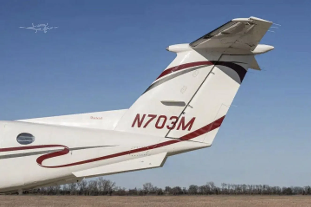 Exterior view of a 1977 BEECHCRAFT KING AIR 200, N703M.