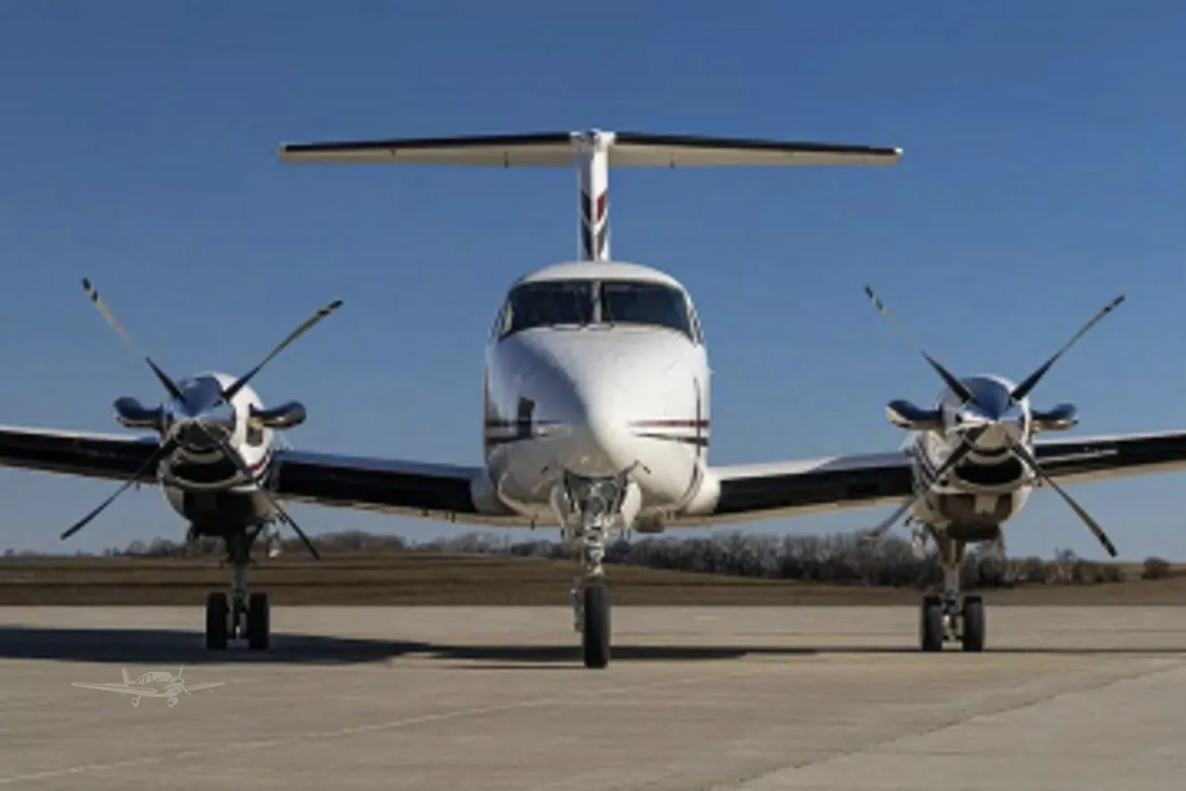 Exterior view of a 1977 BEECHCRAFT KING AIR 200, N703M.