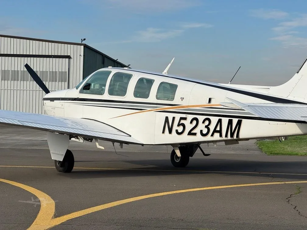 Exterior view of a 1980 BEECHCRAFT A36 BONANZA, N523AM.