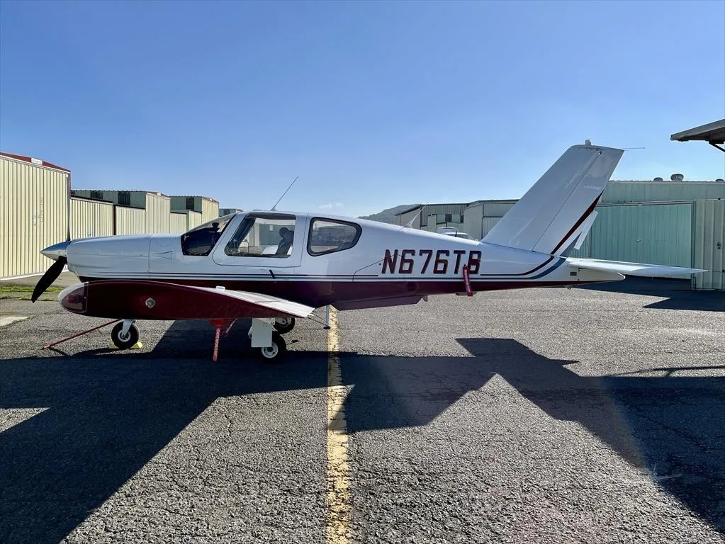 Exterior view of a 1995 SOCATA TB-20 TRINIDAD, N676TB.