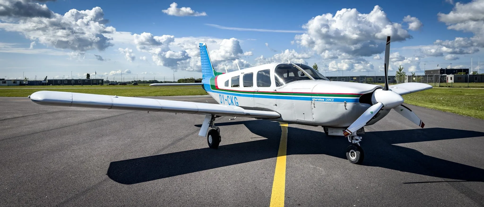 Exterior view of a 1976 PIPER LANCE, OY-CKG.