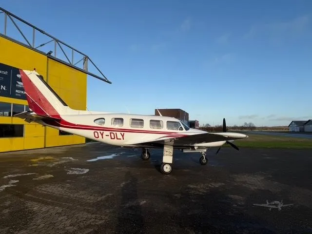 Exterior view of a 1968 PIPER NAVAJO, OY-DLY.