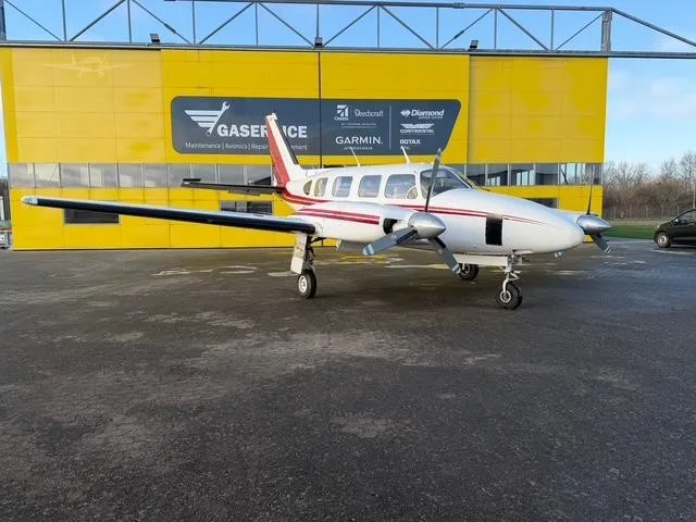 Exterior view of a 1968 PIPER NAVAJO, OY-DLY.