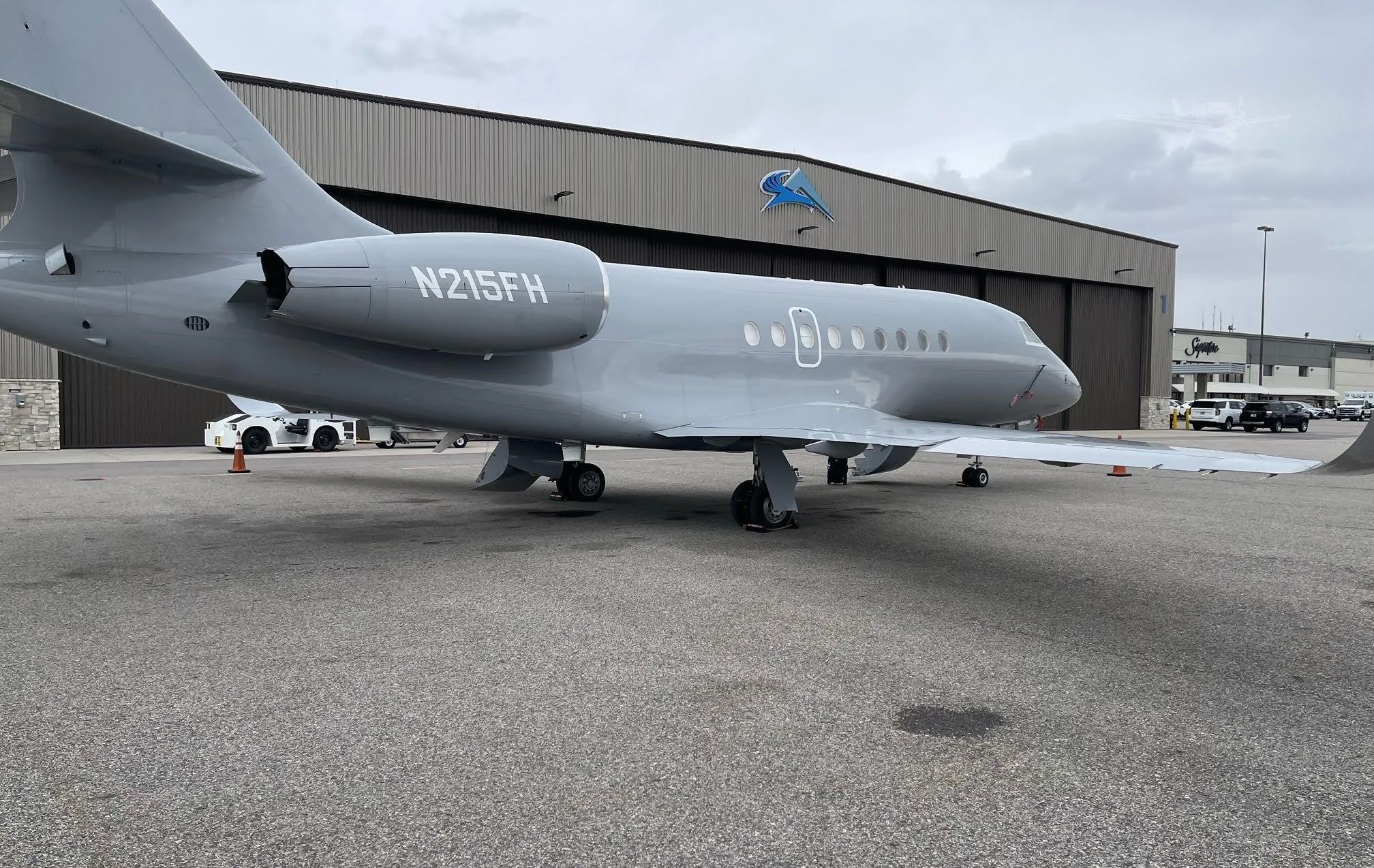 Exterior view of a 2004 DASSAULT FALCON 2000EX EASY, N215FH.