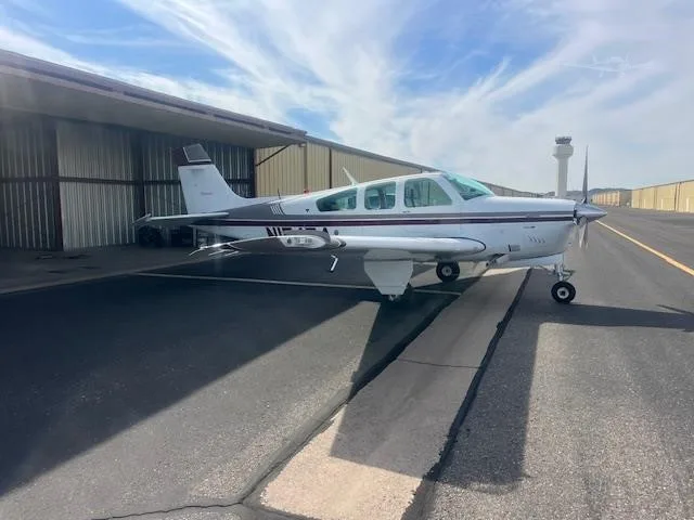 Exterior view of a 1990 BEECHCRAFT F33A BONANZA, N15454.