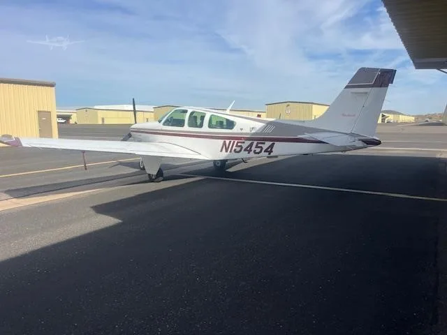 Exterior view of a 1990 BEECHCRAFT F33A BONANZA, N15454.