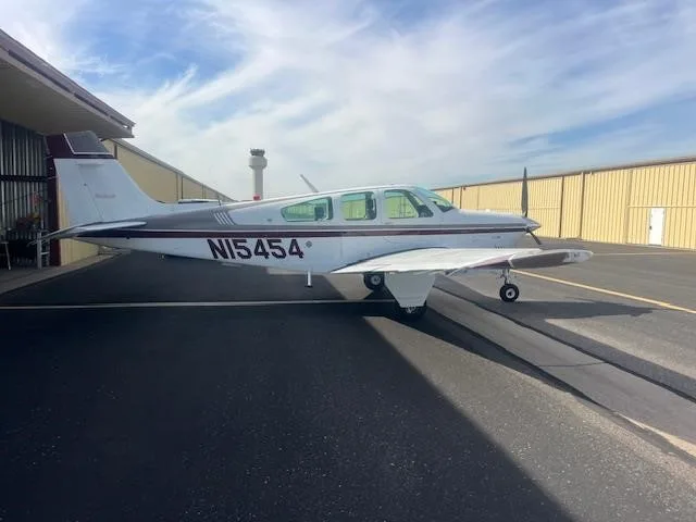 Exterior view of a 1990 BEECHCRAFT F33A BONANZA, N15454.