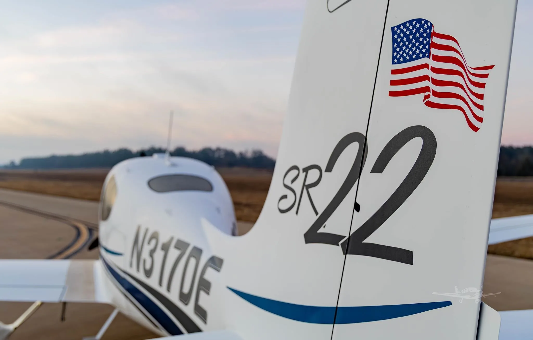 Exterior view of a 2001 CIRRUS SR22, N317DE.