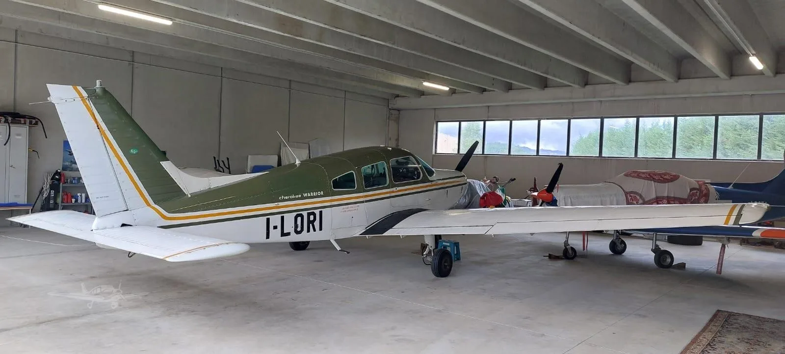 Exterior view of a 1974 PIPER WARRIOR, I-LORI.