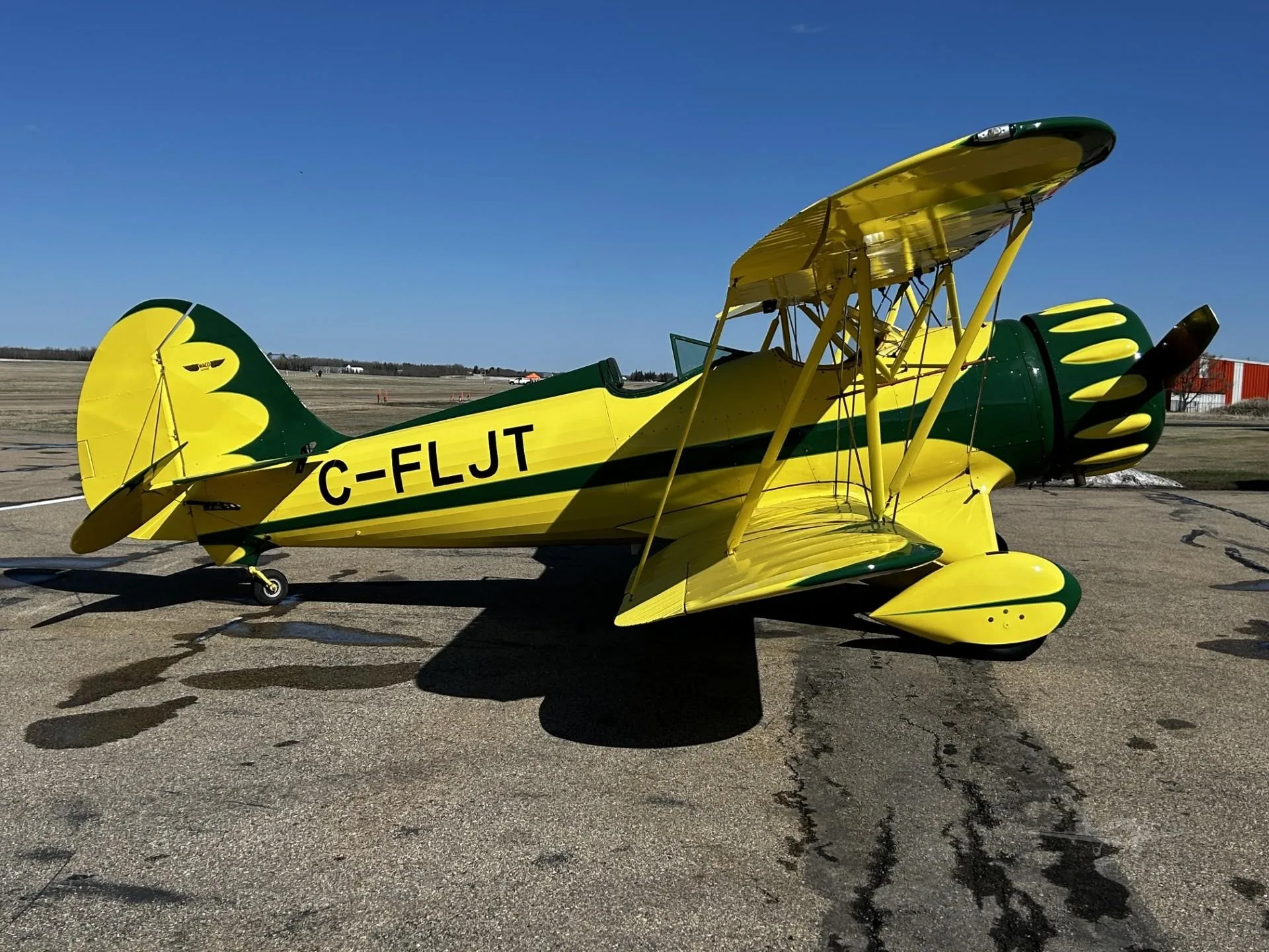 Exterior view of a 2000 WACO YMF-5C, C-FLJT.