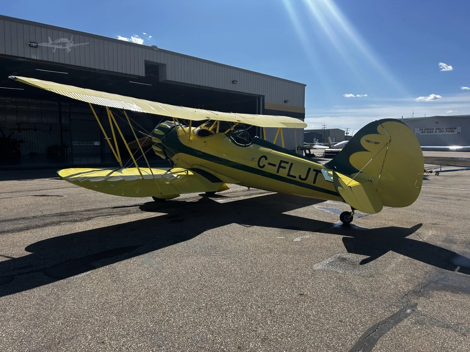 Exterior view of a 2000 WACO YMF-5C, C-FLJT.