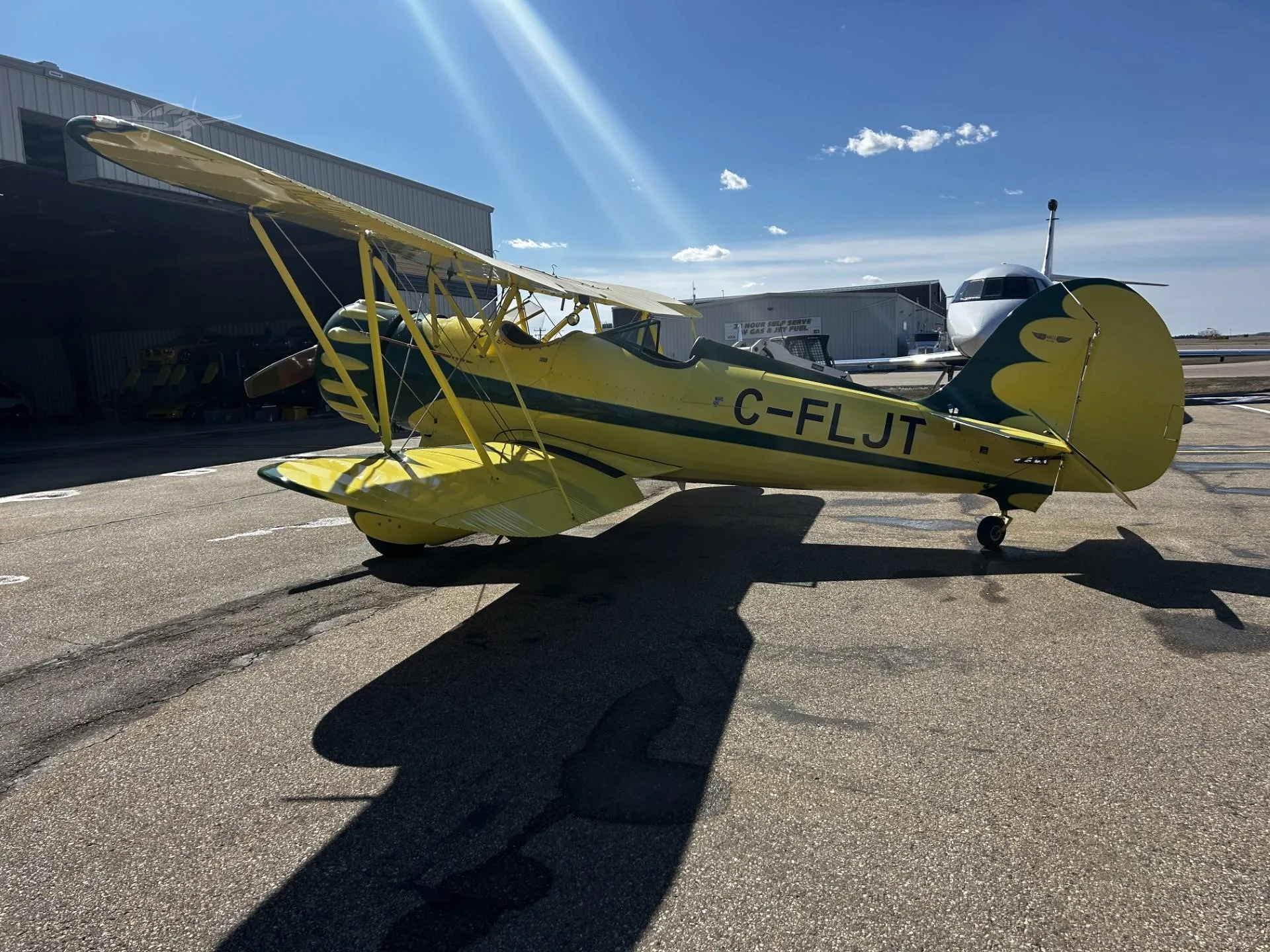 Exterior view of a 2000 WACO YMF-5C, C-FLJT.