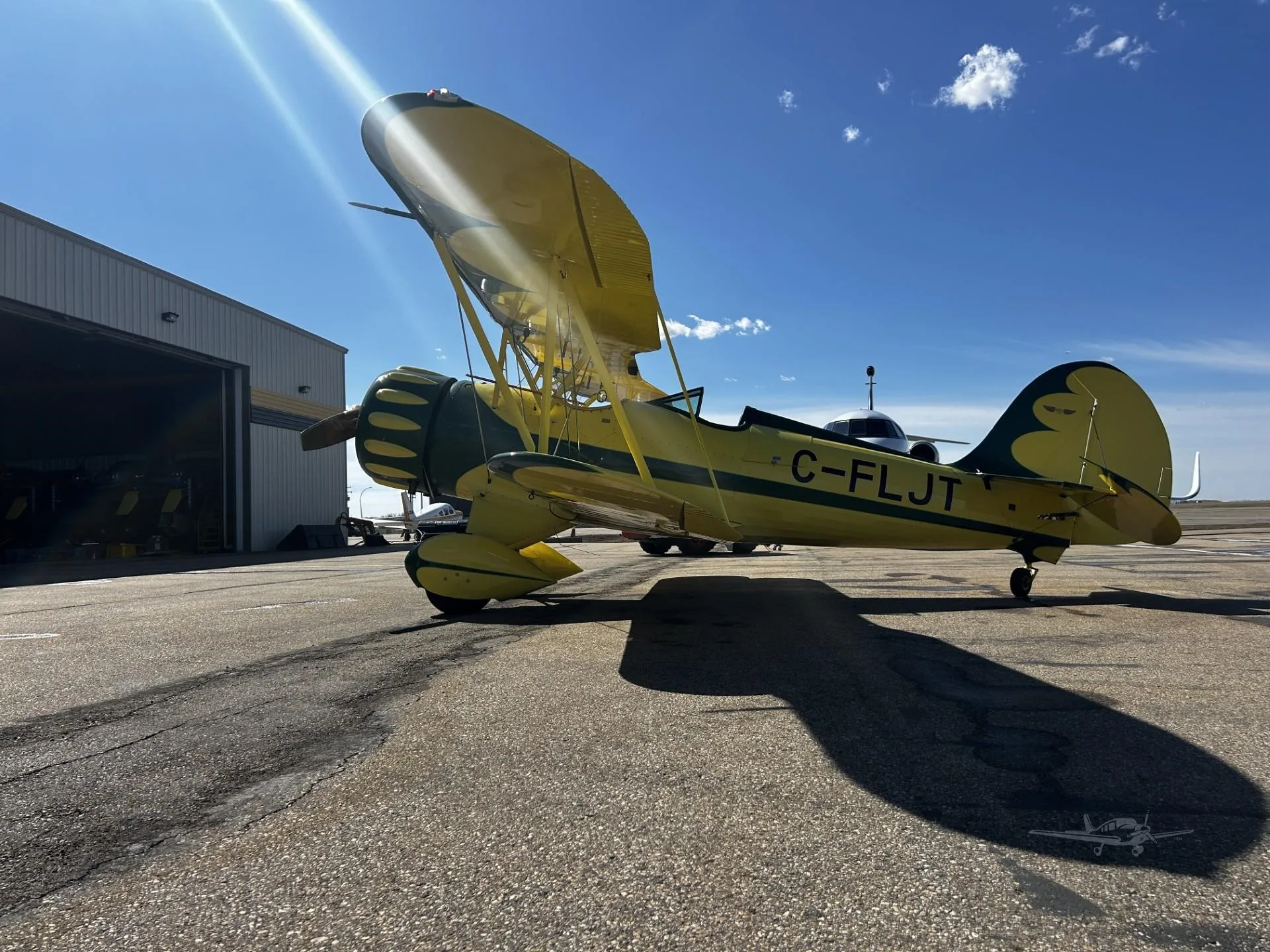 Exterior view of a 2000 WACO YMF-5C, C-FLJT.