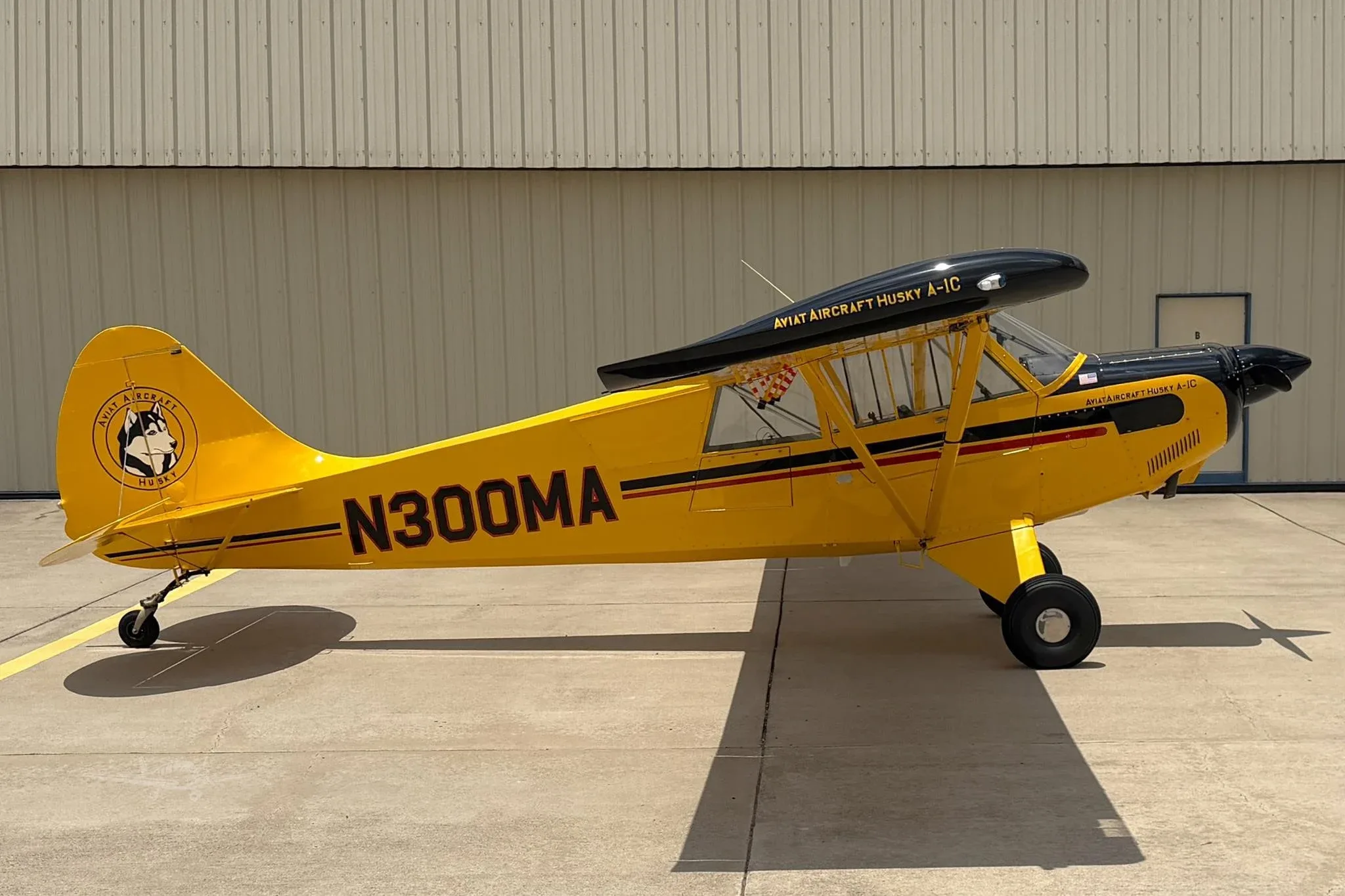 Exterior view of a 2011 AVIAT HUSKY A-1C-180, N300MA.