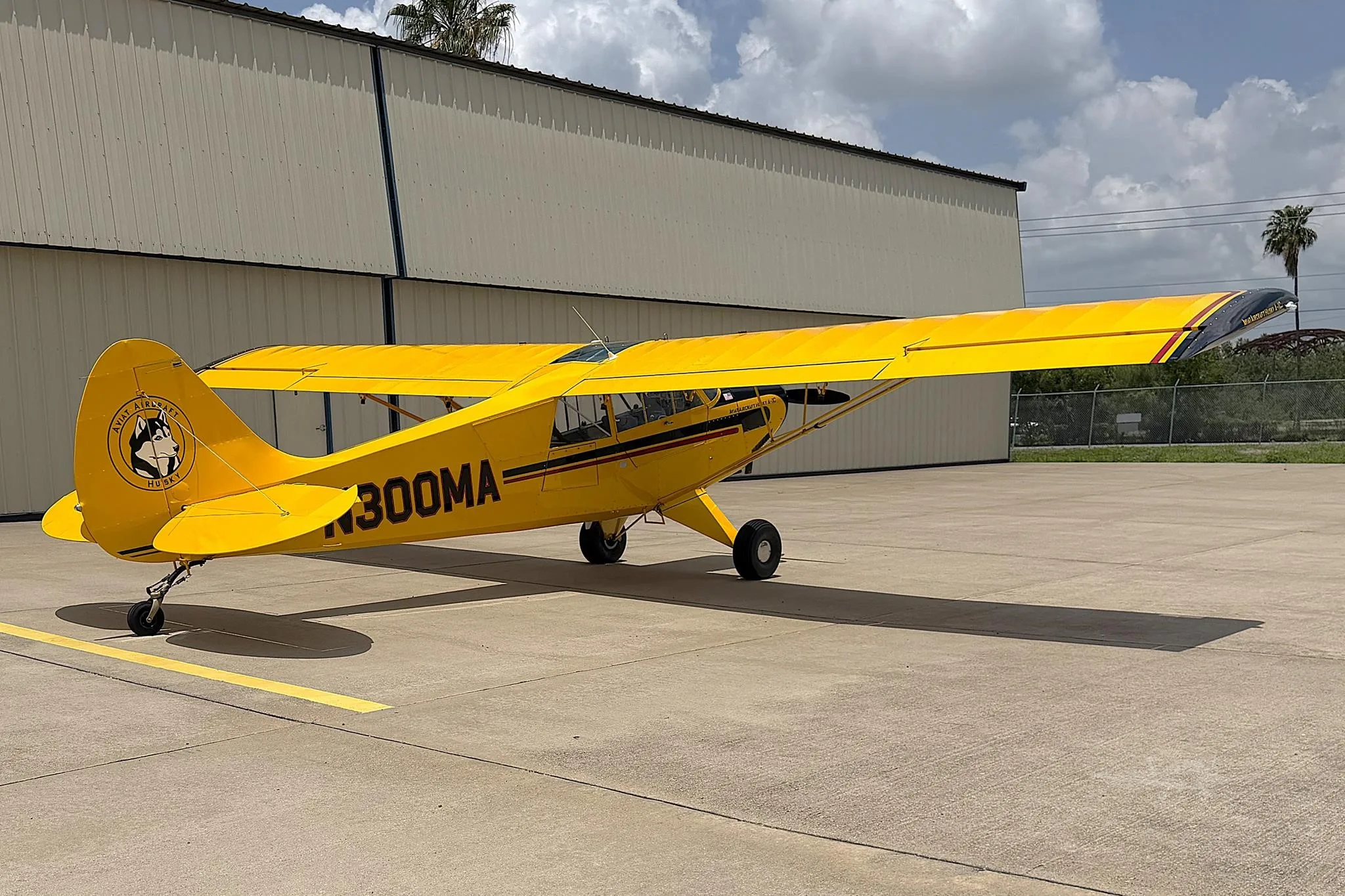 Exterior view of a 2011 AVIAT HUSKY A-1C-180, N300MA.