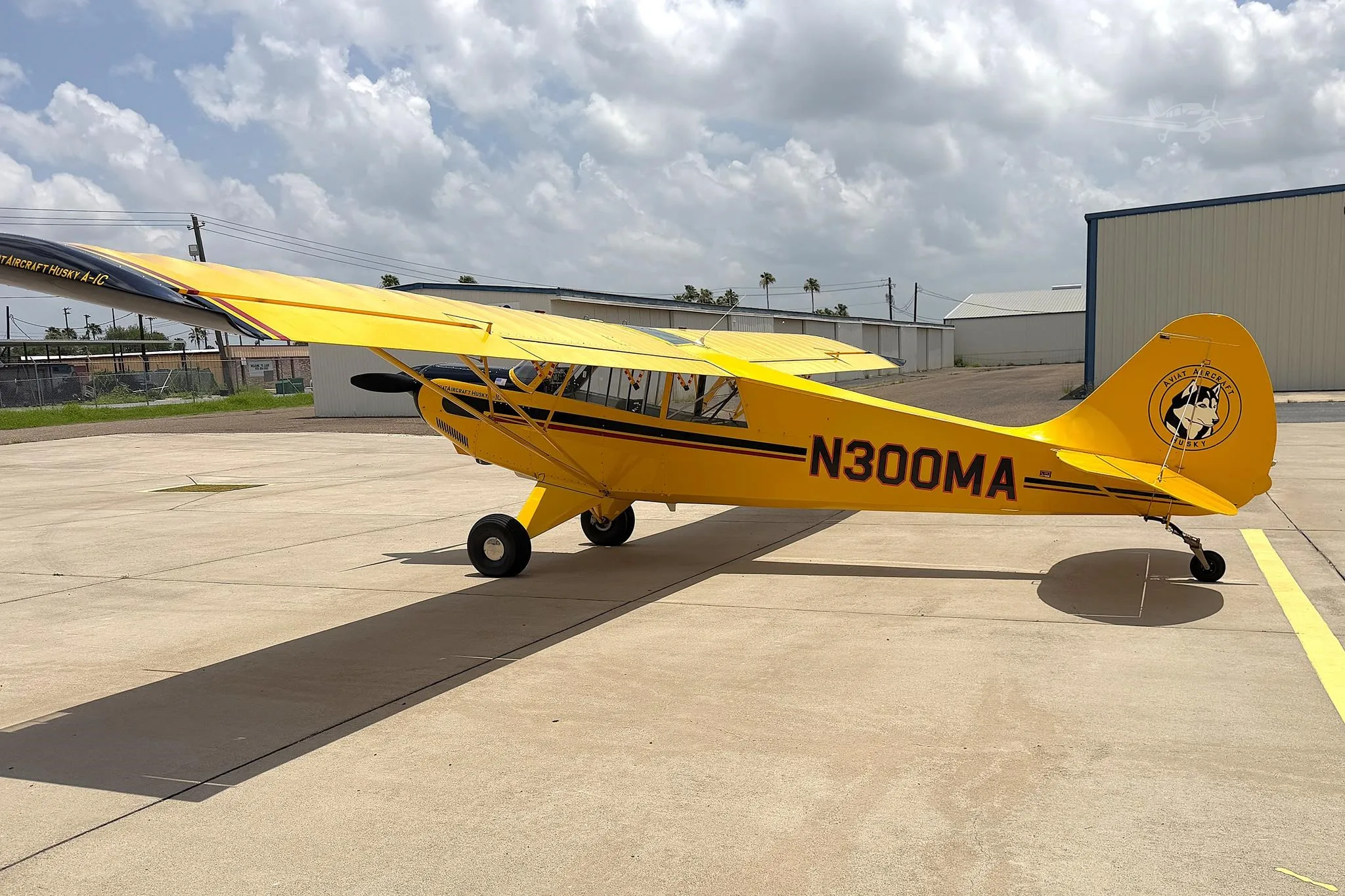 Exterior view of a 2011 AVIAT HUSKY A-1C-180, N300MA.
