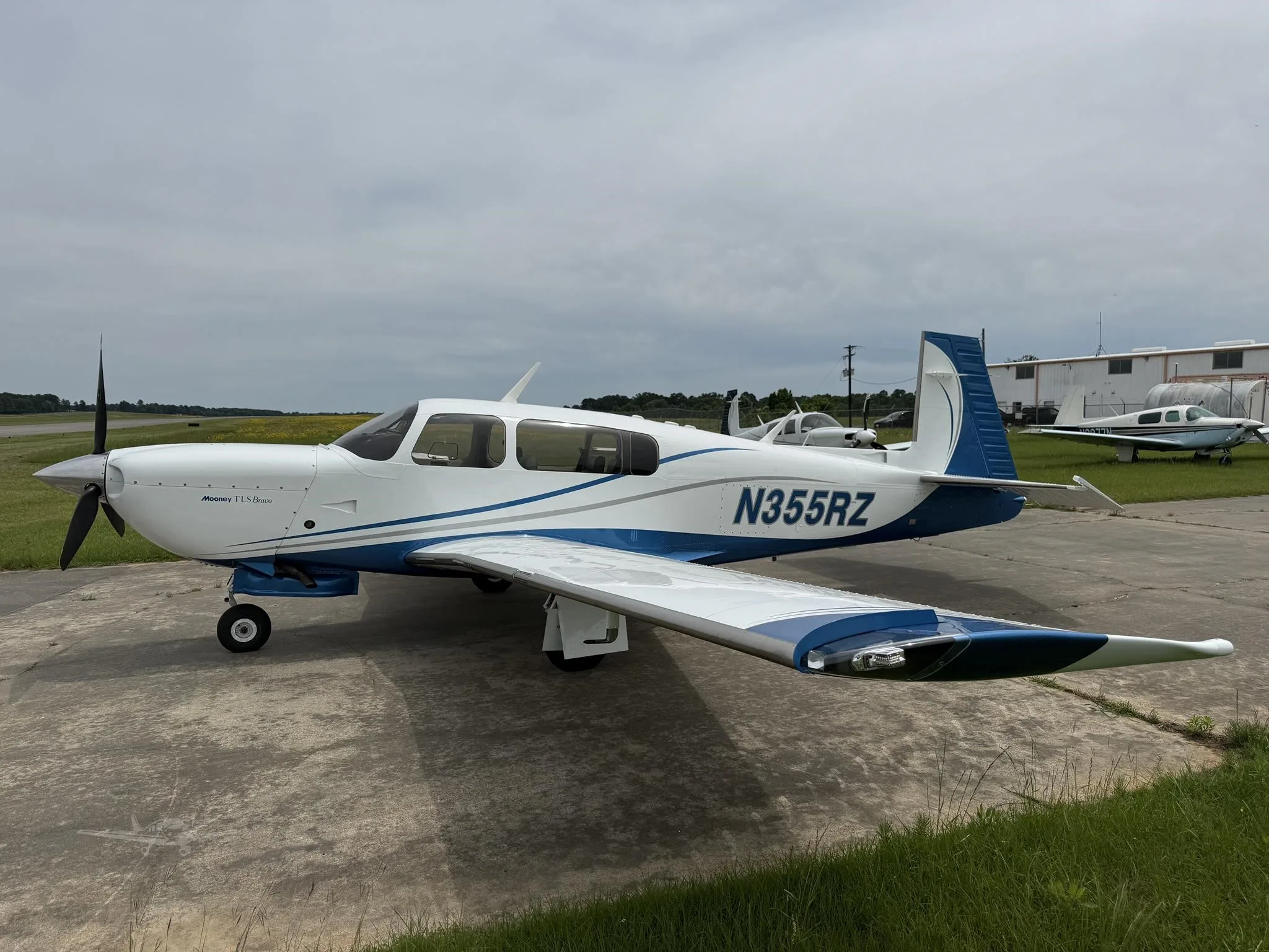 Exterior view of a 1997 MOONEY M20M BRAVO, N355RZ.