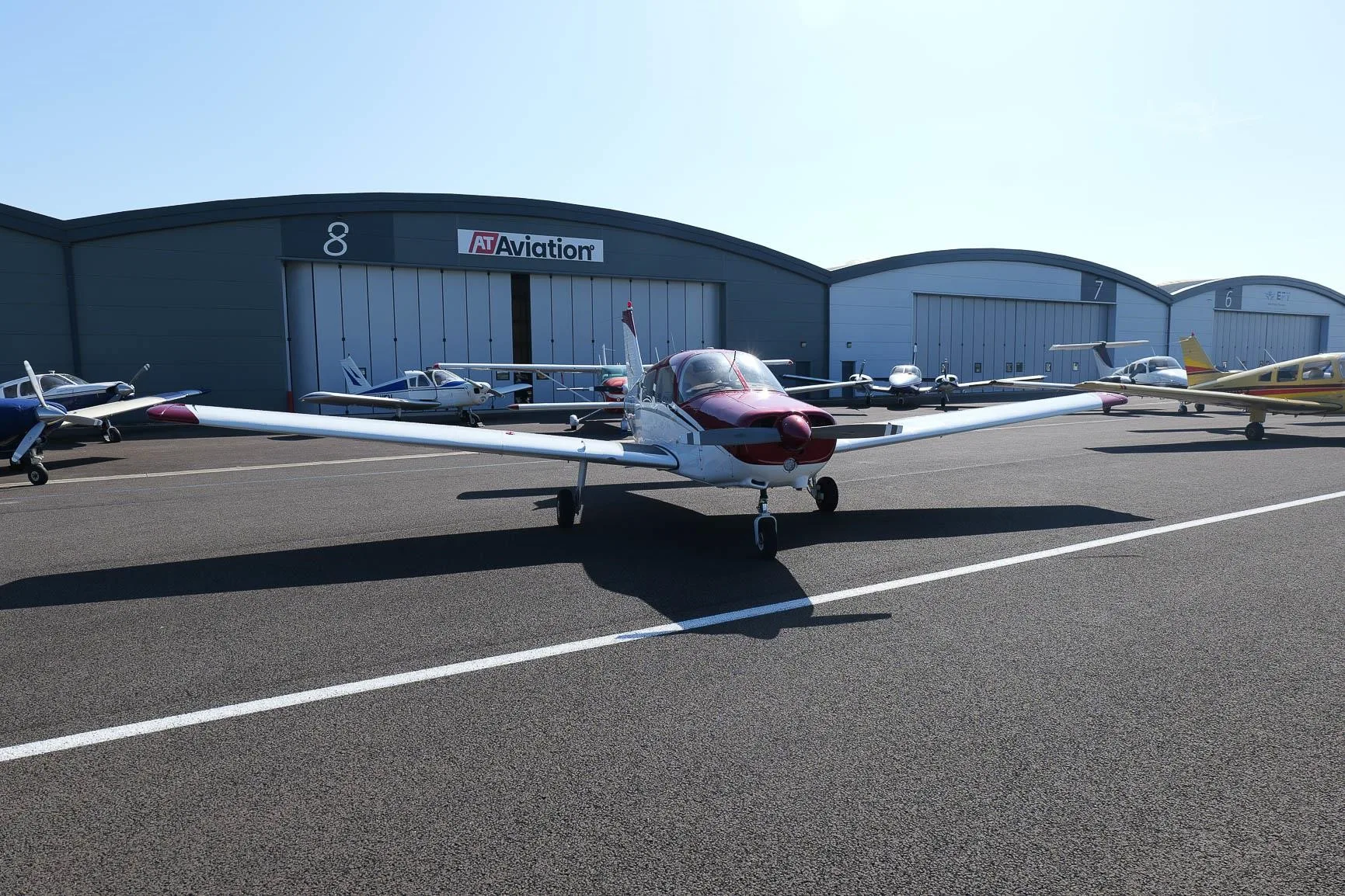 Exterior view of a 1977 PIPER WARRIOR II, G-OZJX.