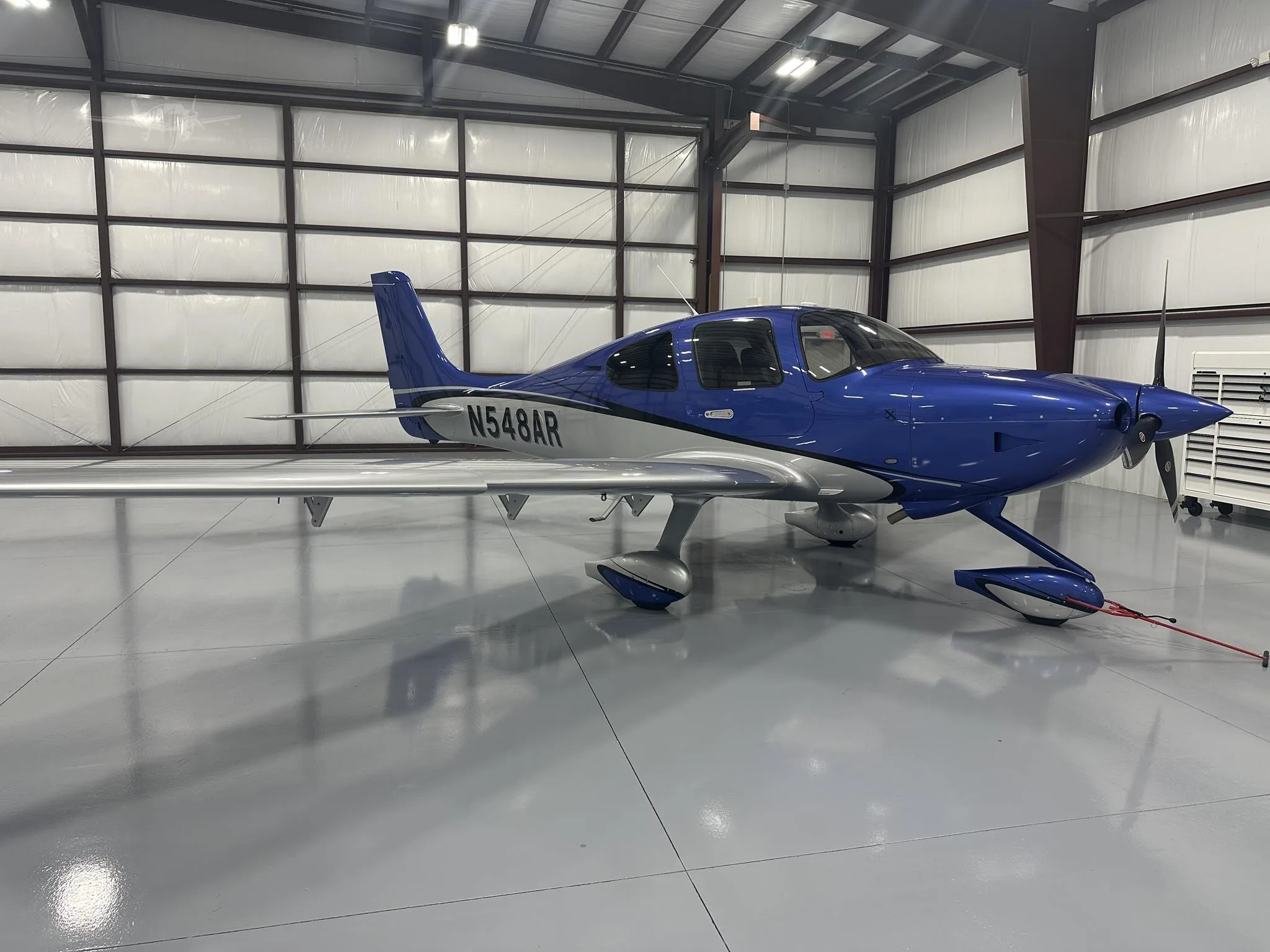 Exterior view of a 2025 CIRRUS SR20-G7, N548AR.