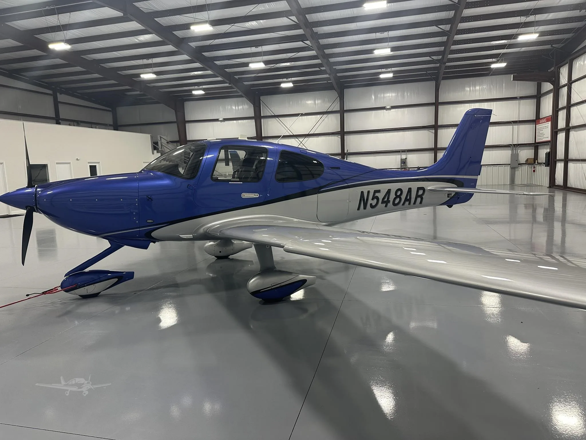 Exterior view of a 2025 CIRRUS SR20-G7, N548AR.