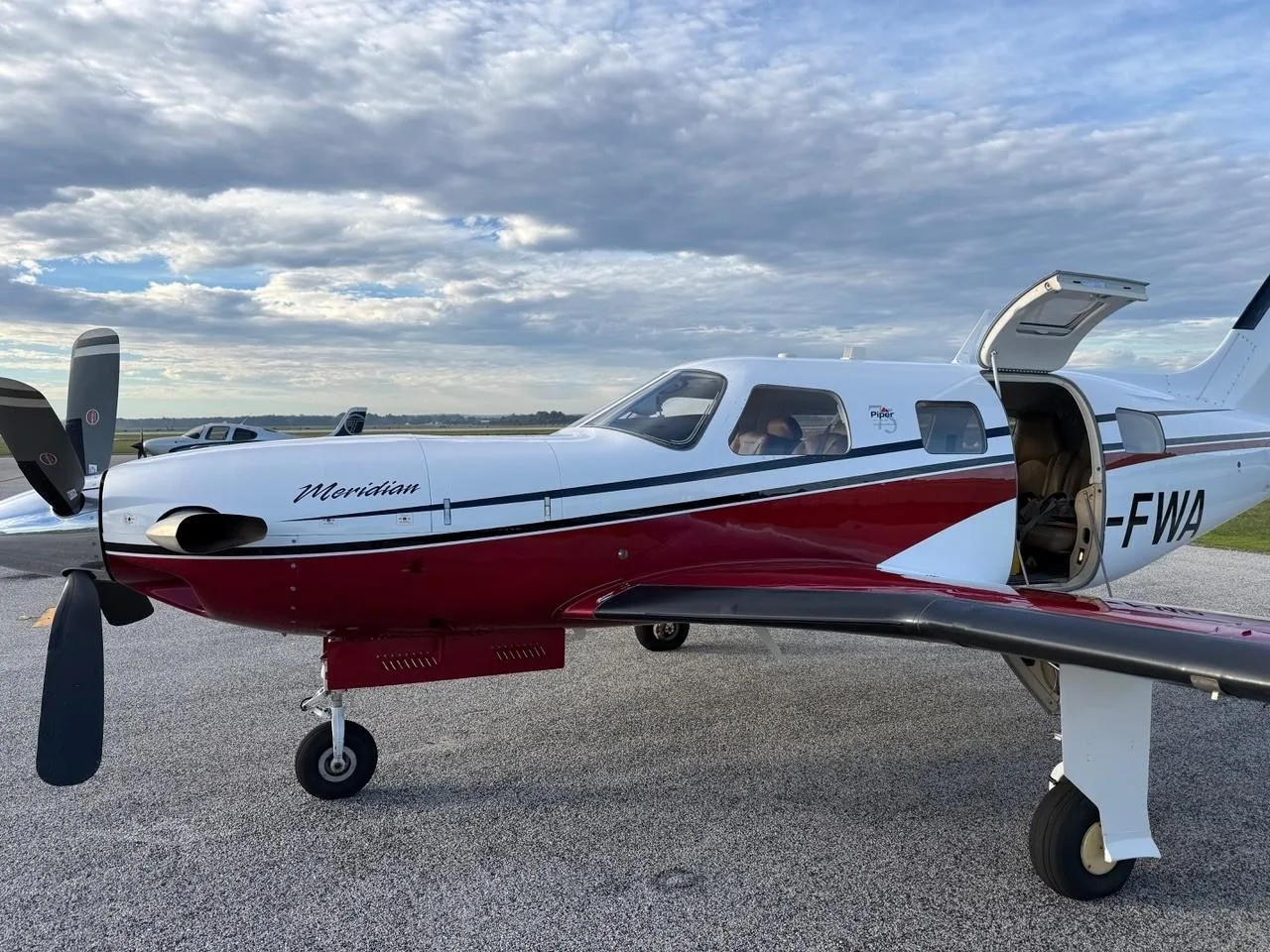 Exterior view of a 2013 PIPER MERIDIAN, VH-FWA.