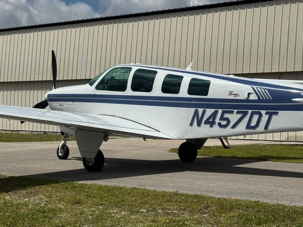 Exterior view of a 1997 BEECHCRAFT A36 BONANZA, N457DT.