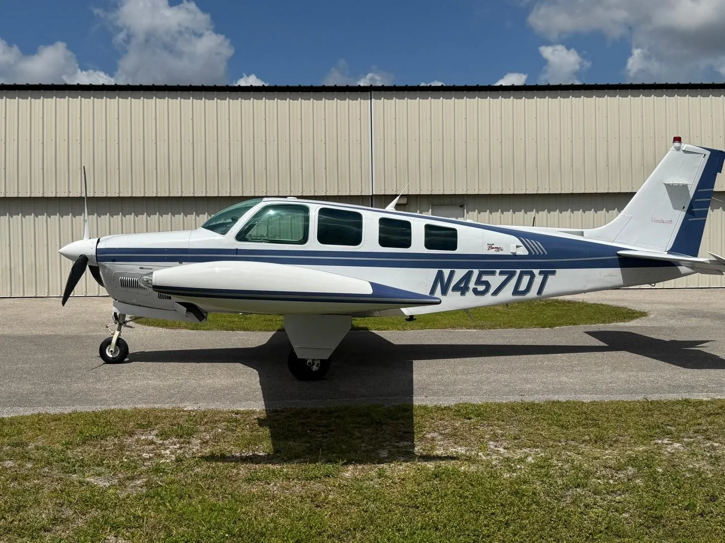 Exterior view of a 1997 BEECHCRAFT A36 BONANZA, N457DT.