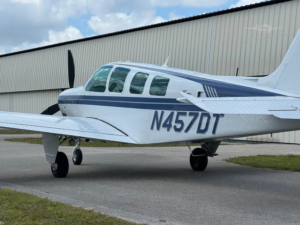 Exterior view of a 1997 BEECHCRAFT A36 BONANZA, N457DT.
