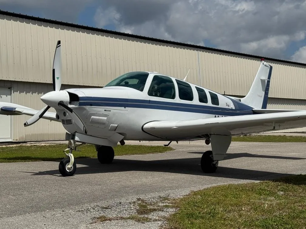 Exterior view of a 1997 BEECHCRAFT A36 BONANZA, N457DT.