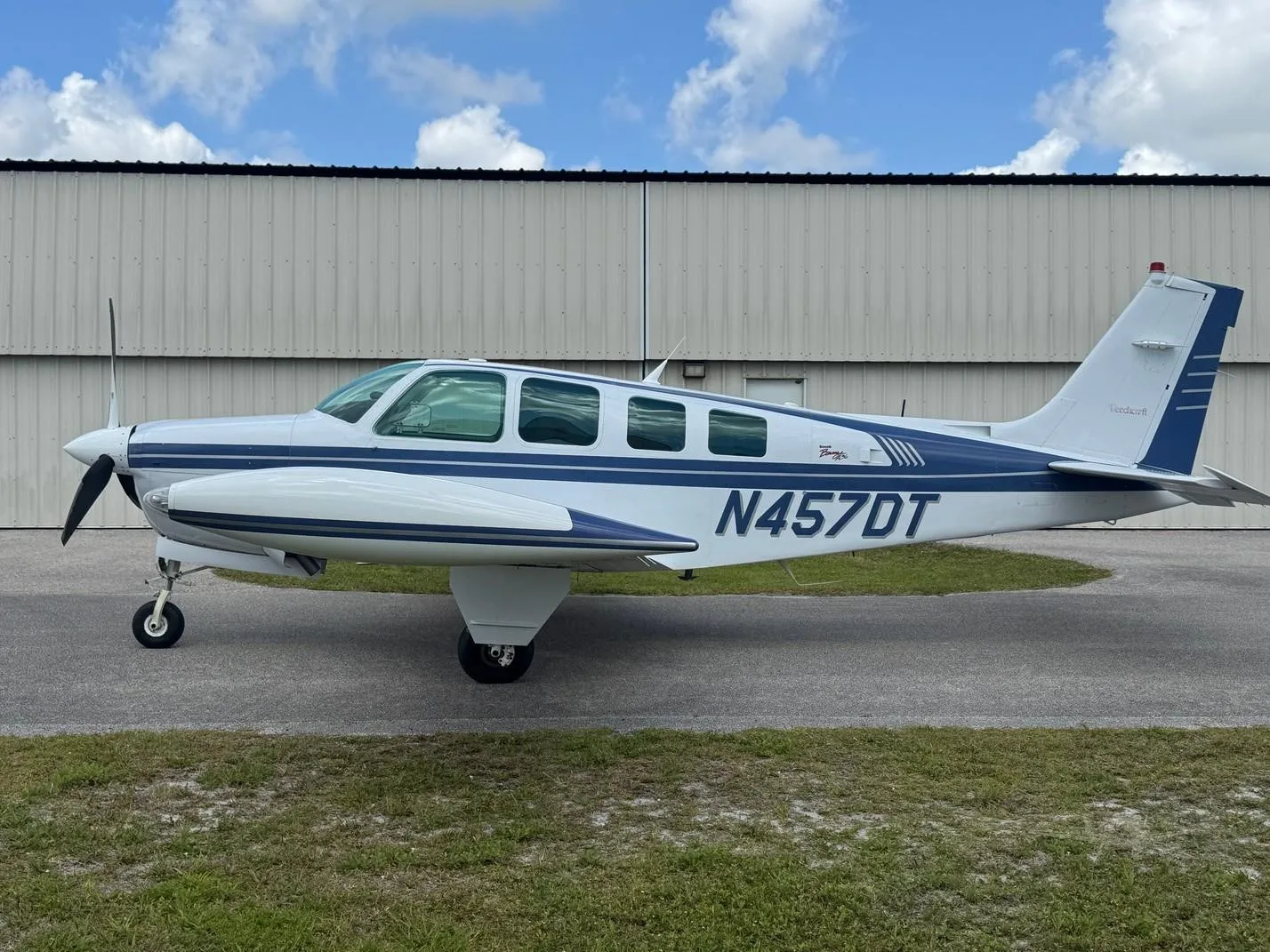 Exterior view of a 1997 BEECHCRAFT A36 BONANZA, N457DT.