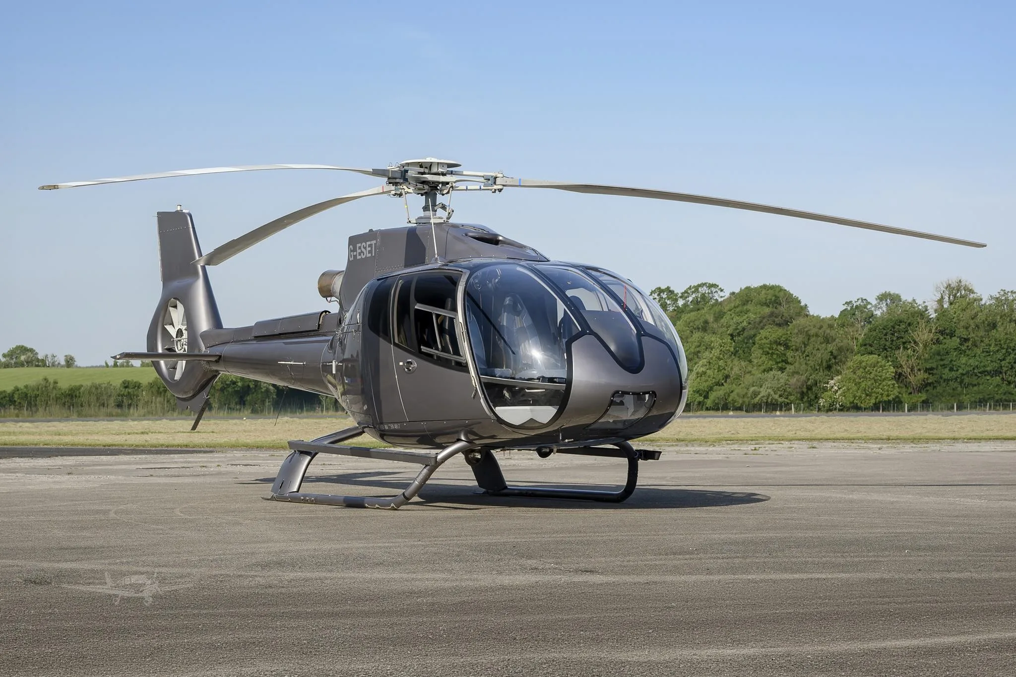 Exterior view of a 2009 EUROCOPTER EC130B4, G-ESET.