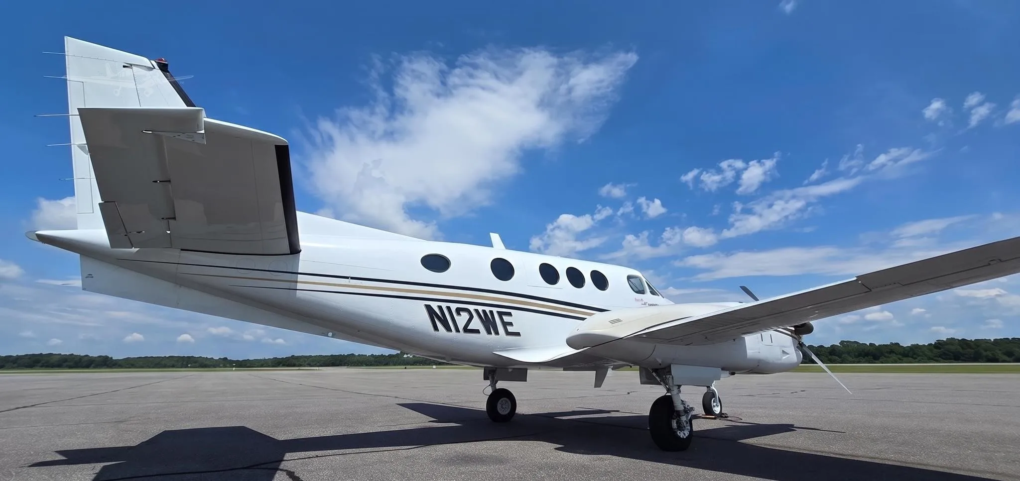 Exterior view of a 2008 BEECHCRAFT KING AIR C90GTI, N12WE.