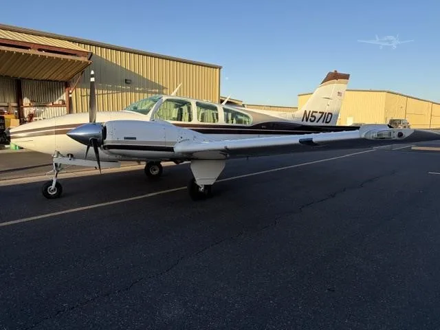 Exterior view of a 1975 BEECHCRAFT E55 BARON, N571D.