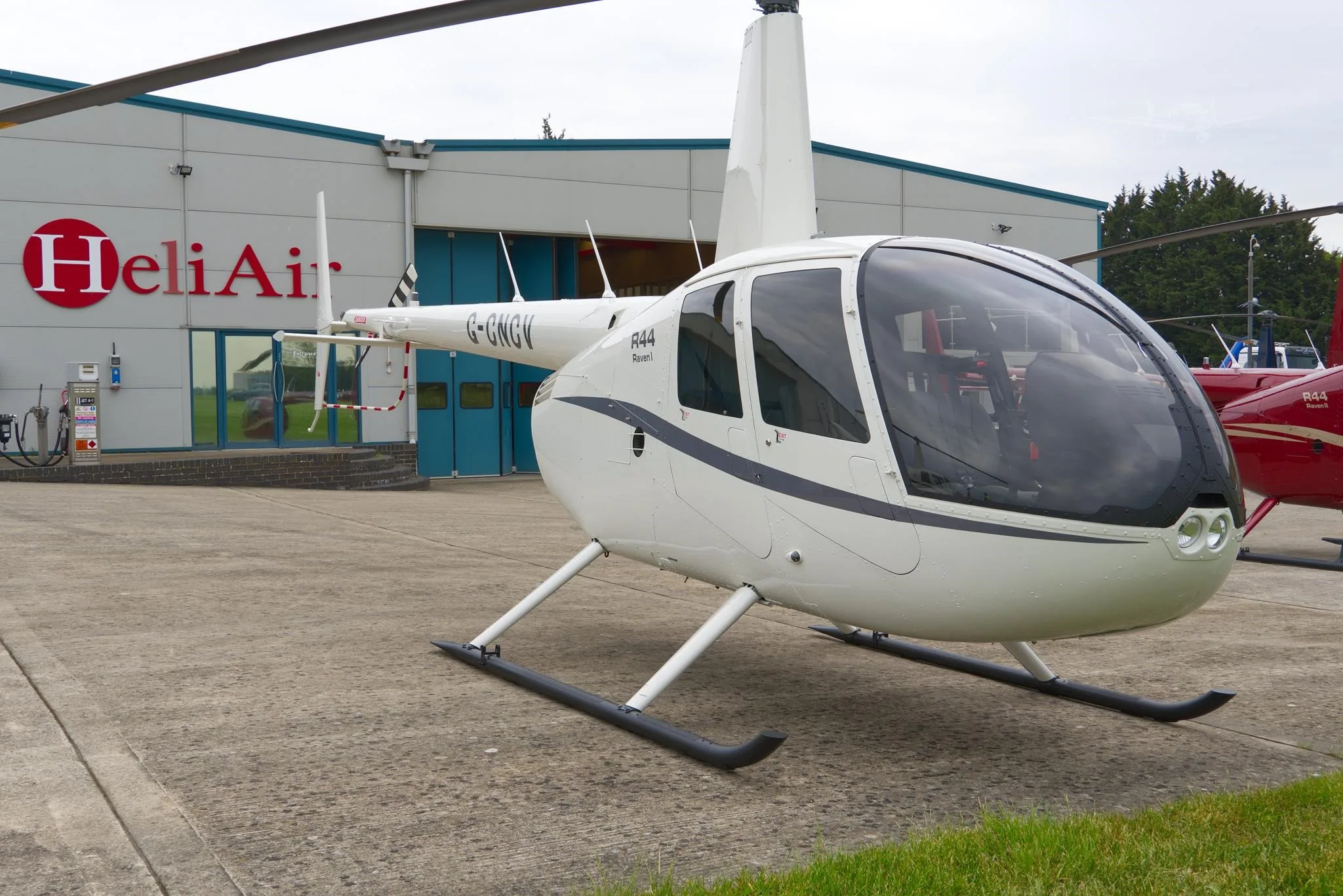 Exterior view of a ROBINSON R44 RAVEN I, G-CNCV.