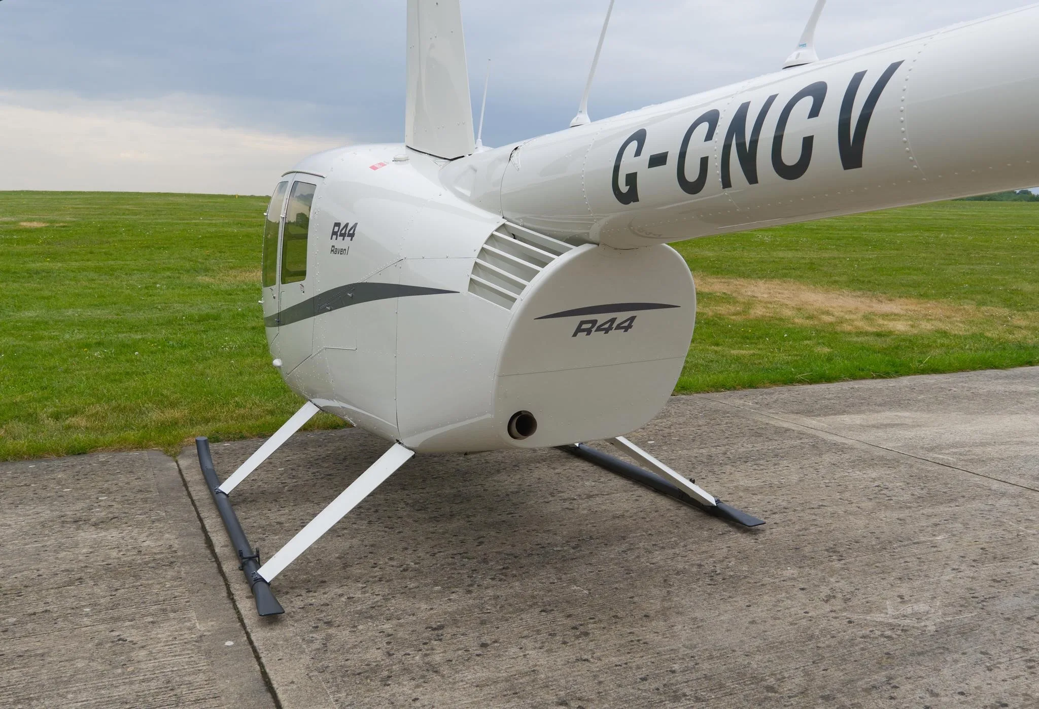 Exterior view of a ROBINSON R44 RAVEN I, G-CNCV.