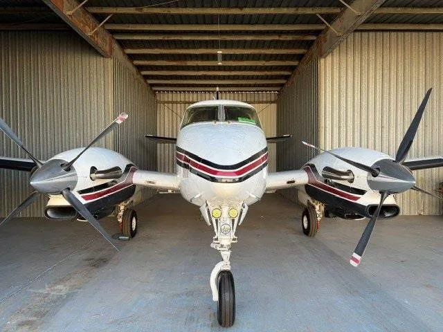 Exterior view of a 1975 BEECHCRAFT KING AIR C90, N717JG.