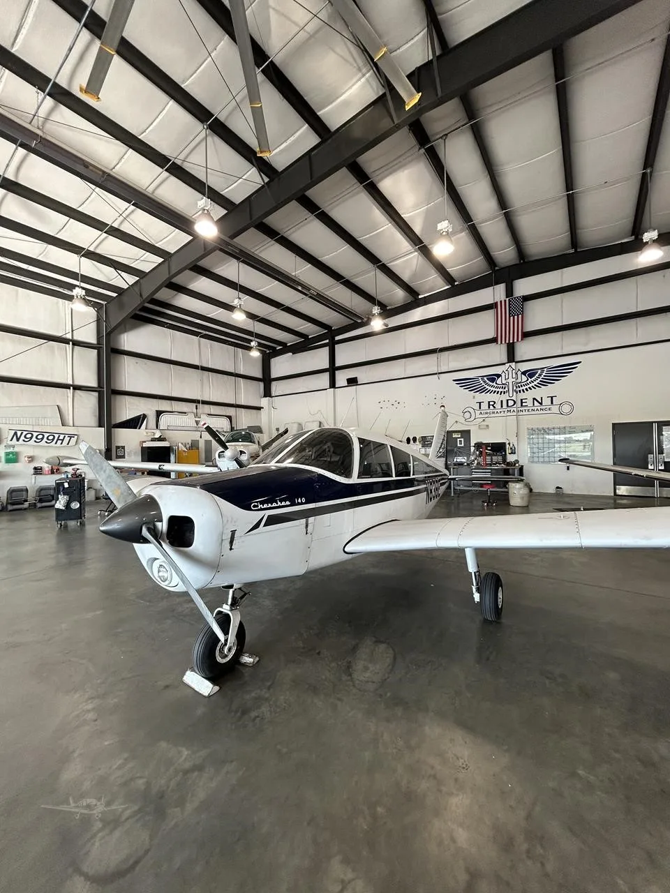 Exterior view of a 1967 PIPER CHEROKEE 140, N83BE.