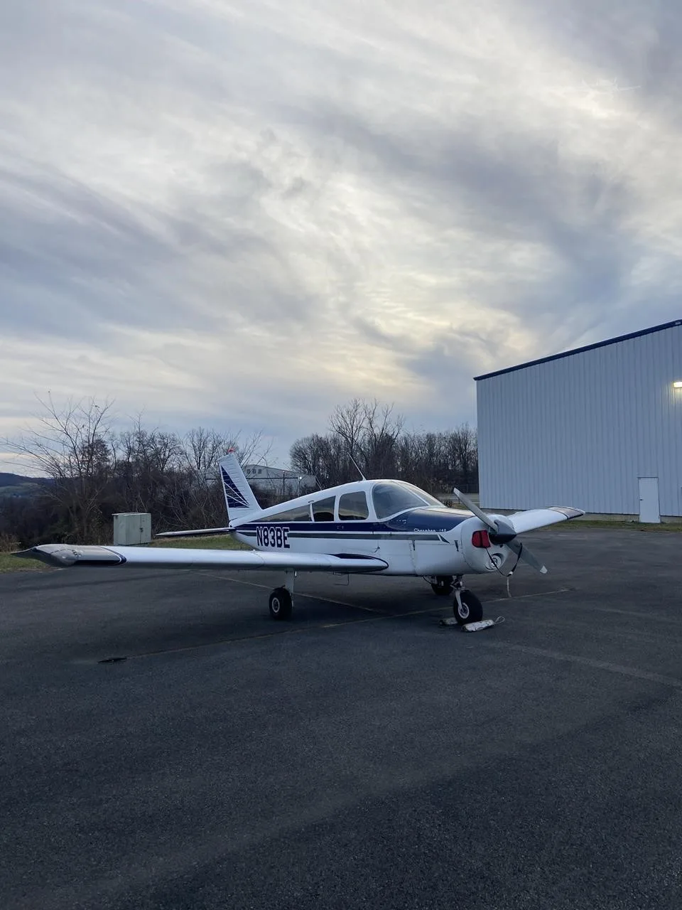 Exterior view of a 1967 PIPER CHEROKEE 140, N83BE.