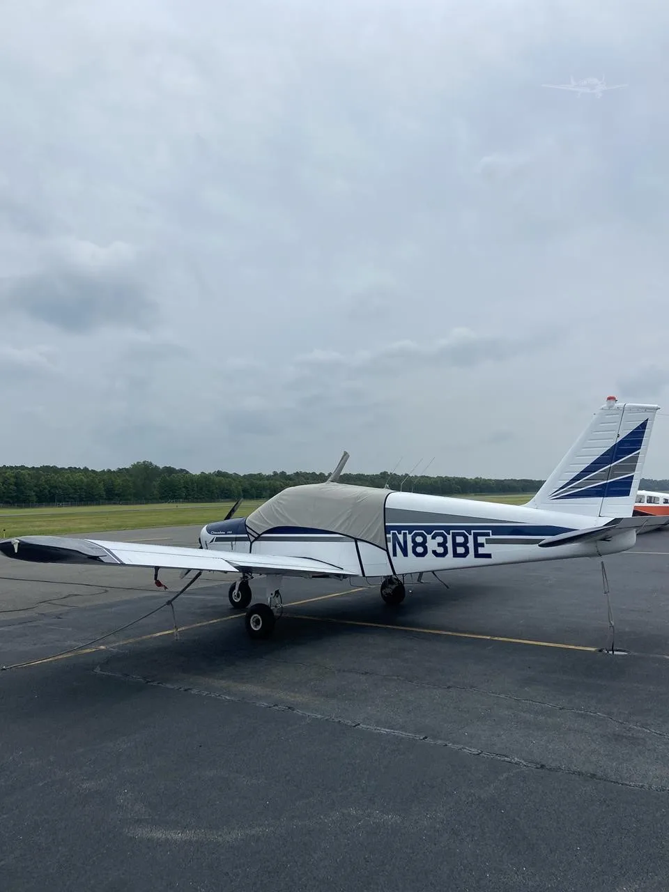 Exterior view of a 1967 PIPER CHEROKEE 140, N83BE.