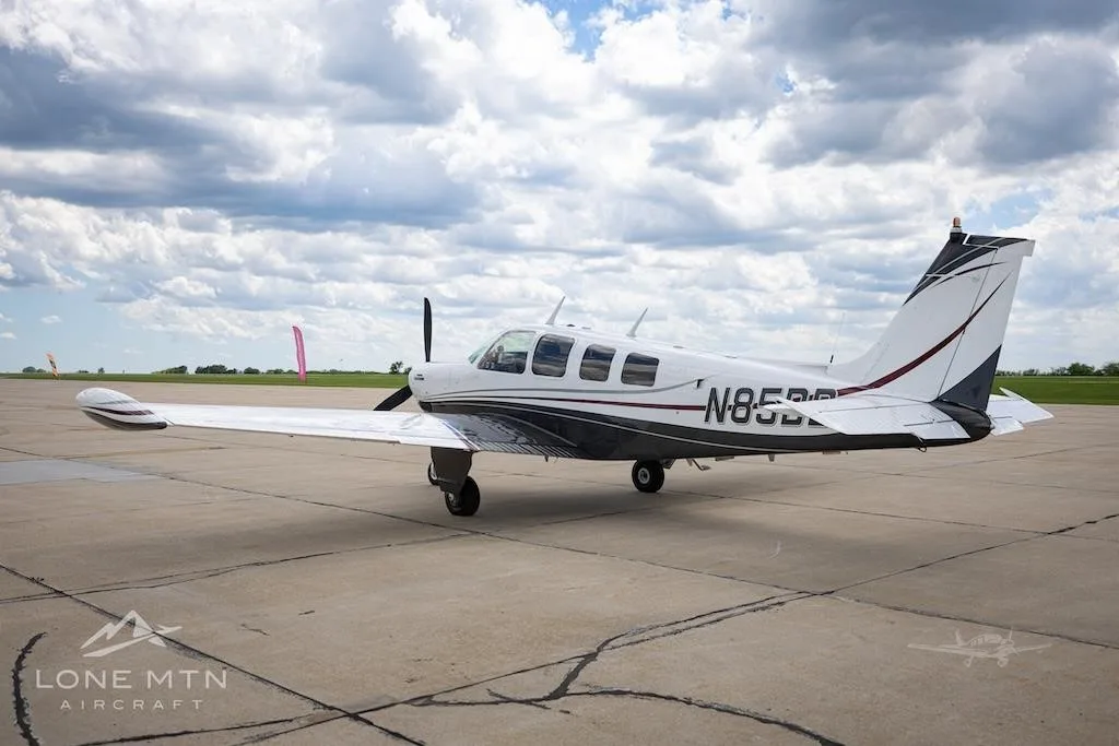 Exterior view of a 1973 BEECHCRAFT A36 BONANZA, N85BB.