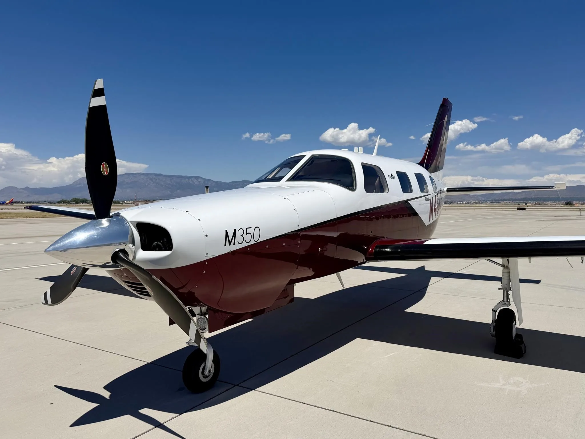 Exterior view of a 2019 PIPER M350, N464JF.