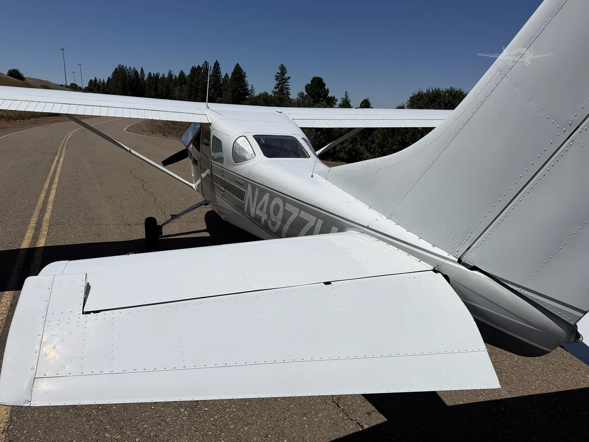 Exterior view of a 1965 CESSNA 210, N4977U.