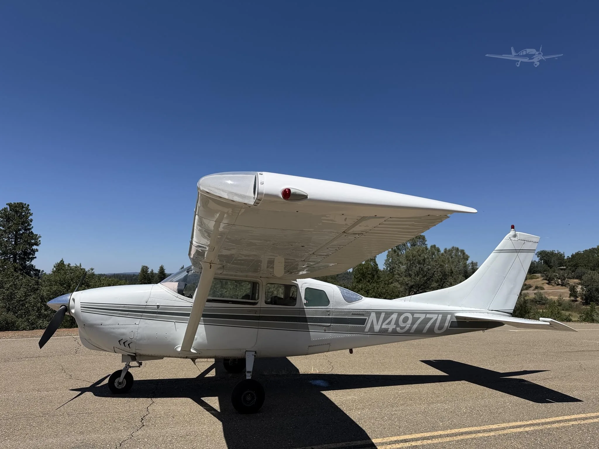 Exterior view of a 1965 CESSNA 210, N4977U.
